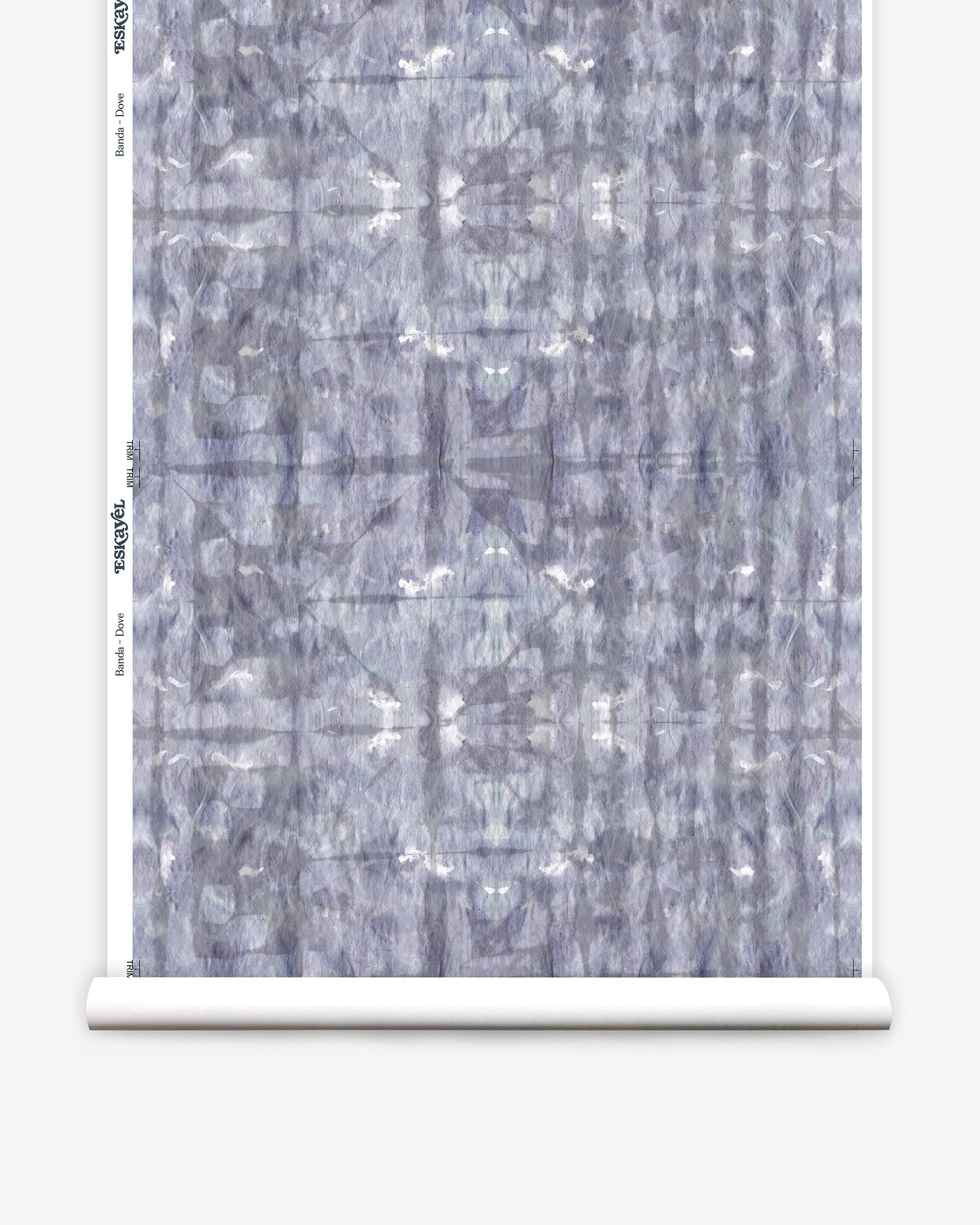 A roll of Banda Wallpaper Dove with a blue and white Shibori tie-dye pattern on it
