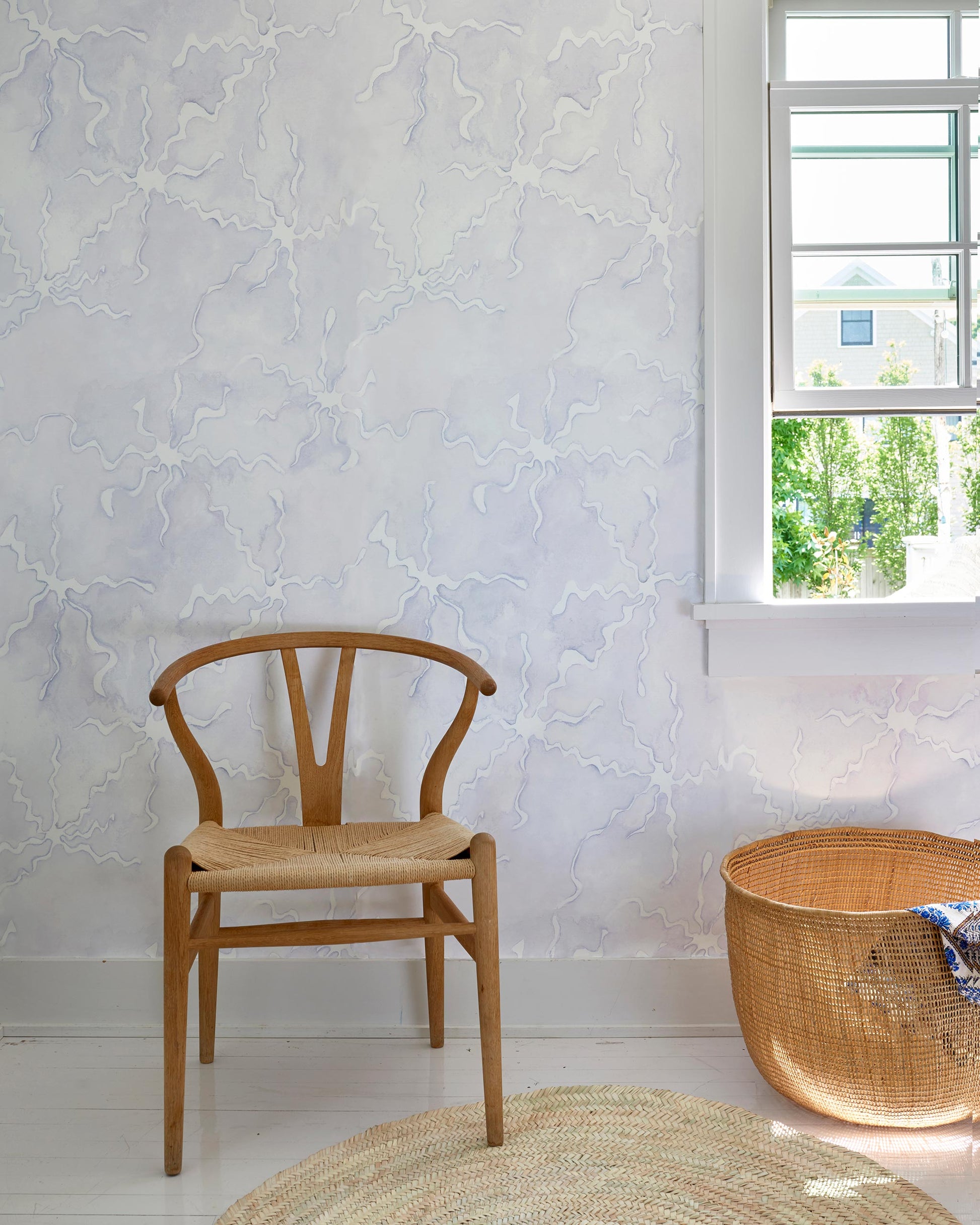 A room with a chair, a window, and Pecosa Wallpaper Air