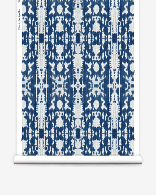 A Biami Wallwallpaper Indigo Ikat with a blue and white ikat pattern on a roll of wallpaper