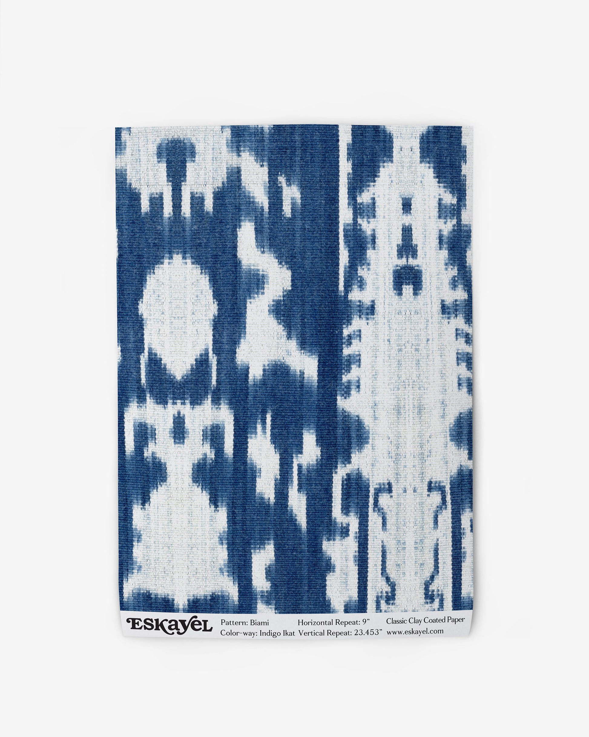 A blue and white Biami Wallpaper Indigo Ikat print on a high-end fabric