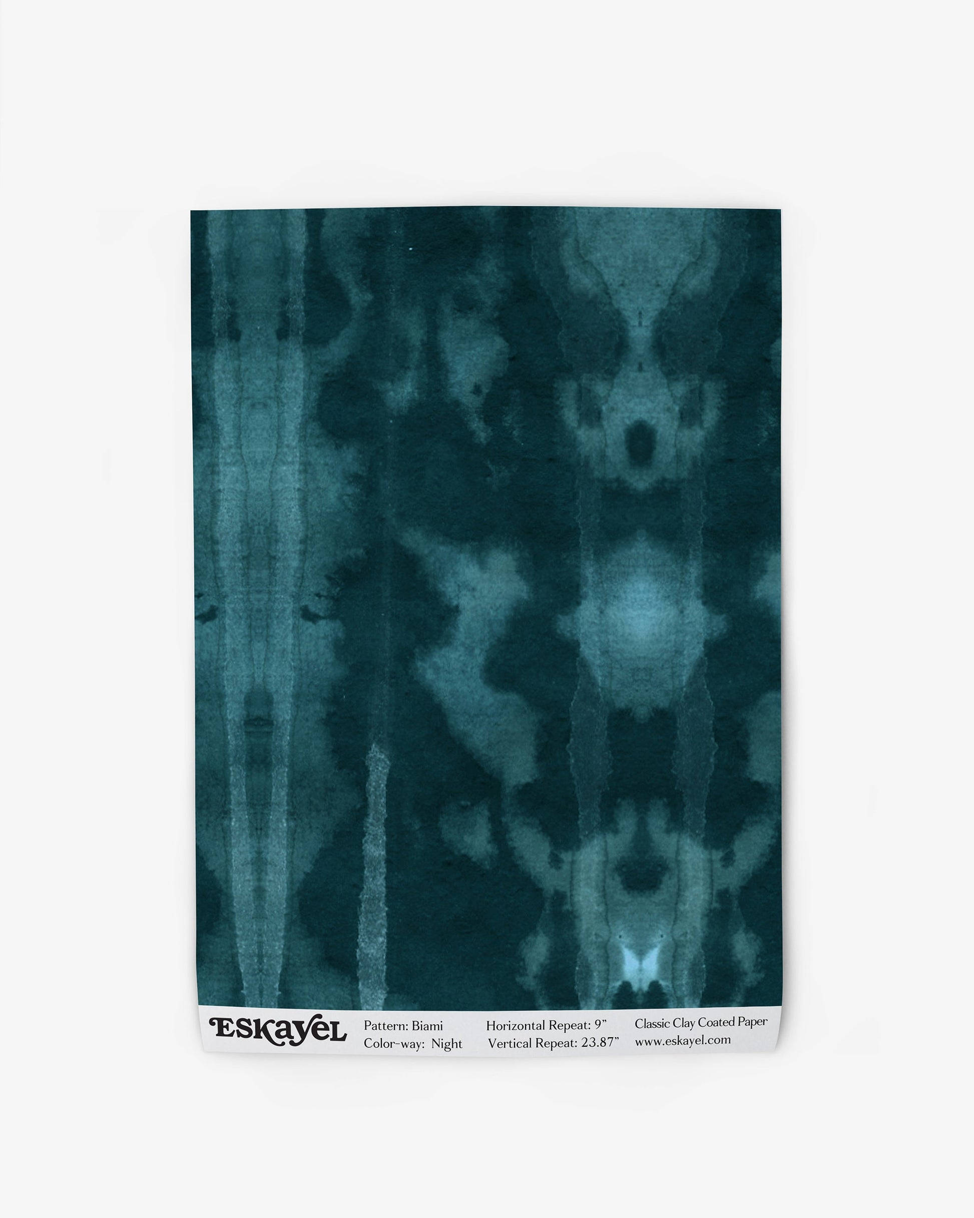 A high-end fabric with a teal and black Biami Wallpaper Night pattern on wallpaper