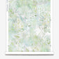 A white and green floral Cortile Wallpaper Luminosa on a roll