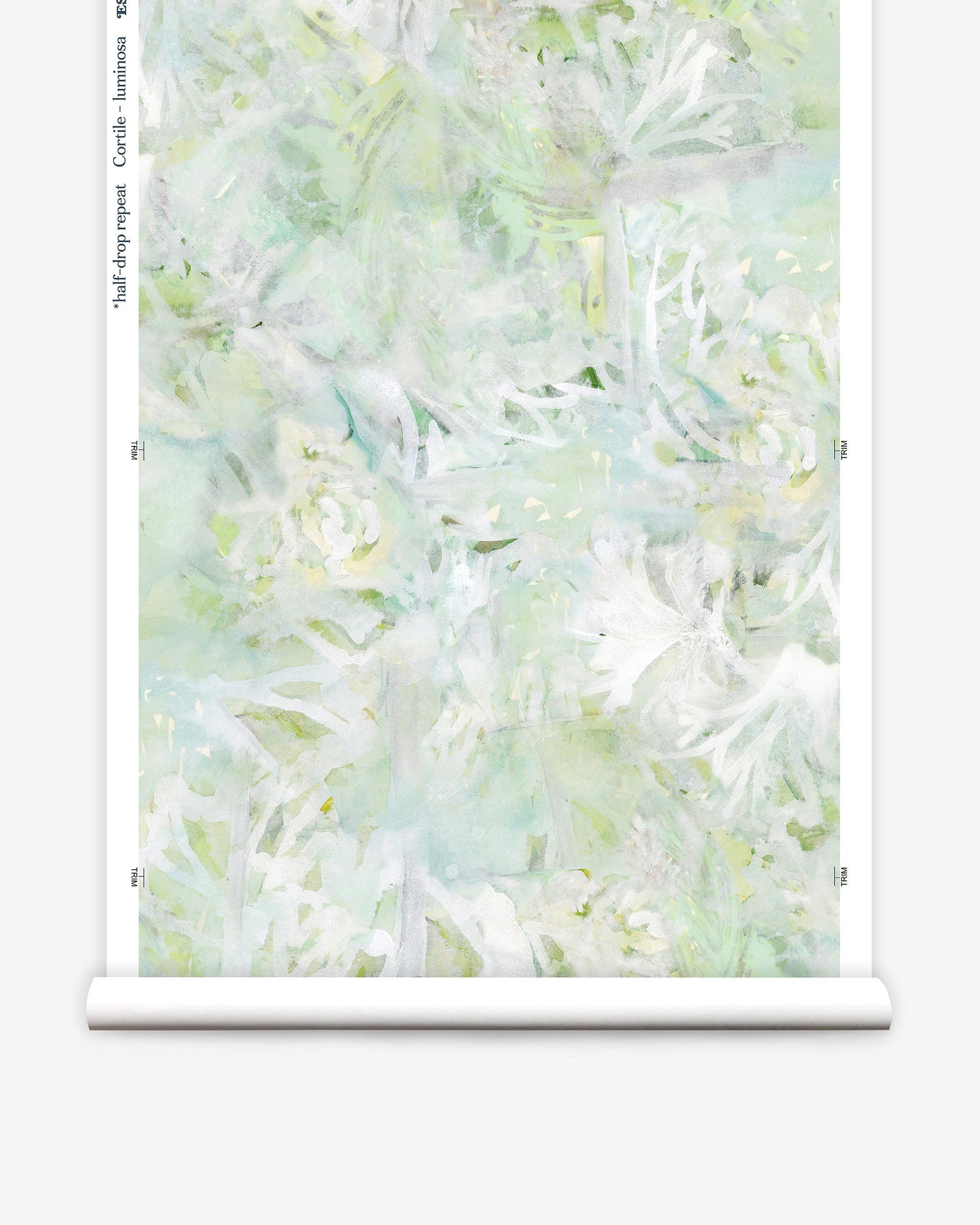 A white and green floral Cortile Wallpaper Luminosa on a roll