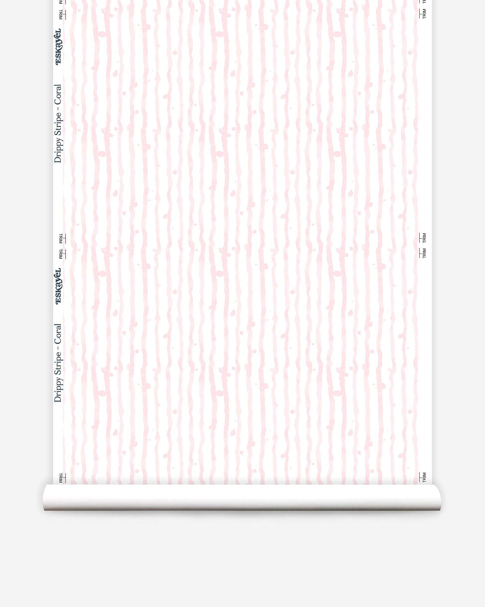 A pink and white roll of custom fabric with a Drippy Stripe Wallpaper||Coral pattern on it.