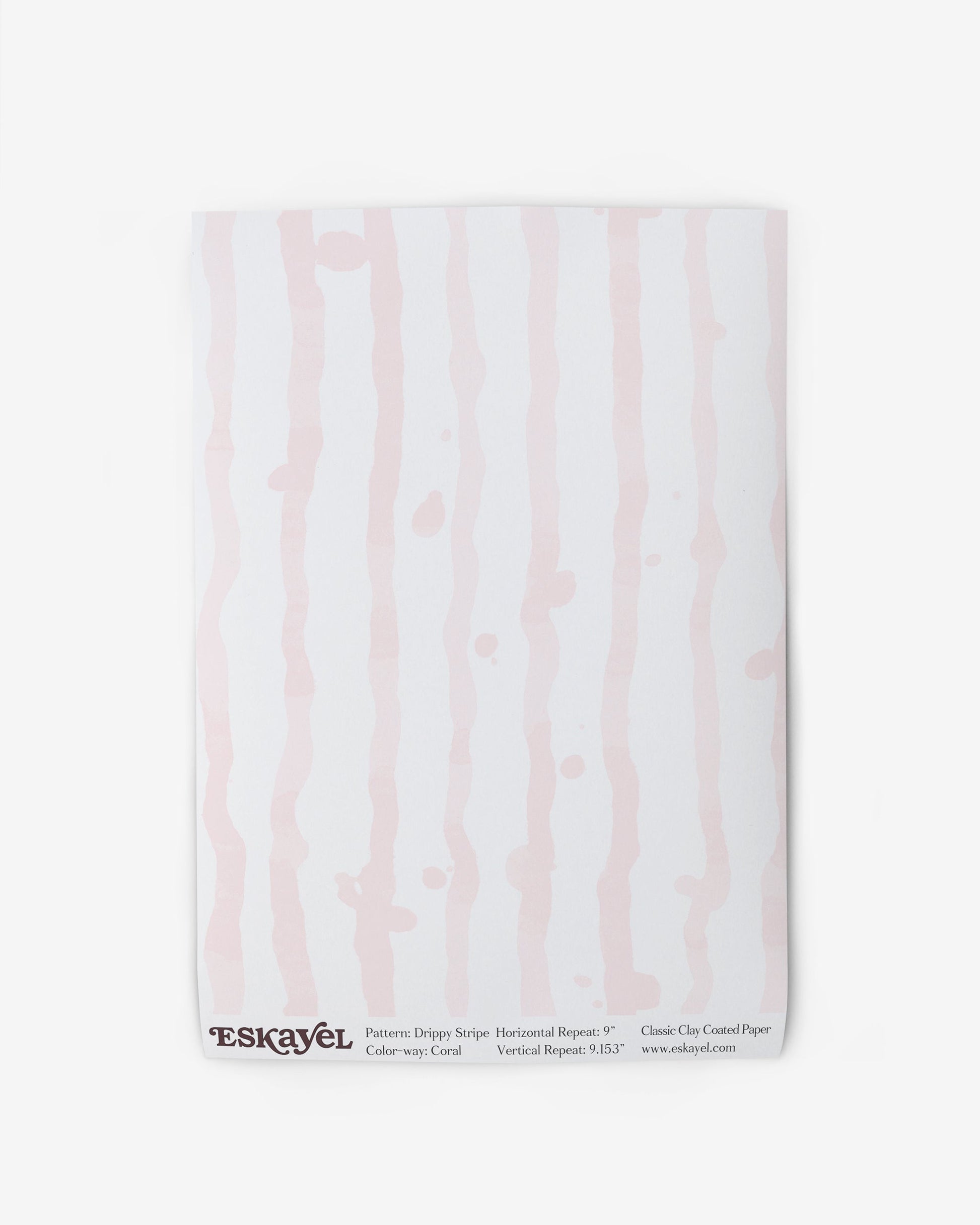A white Drippy Stripe Wallpaper Sample Coral with pink and white stripes on it