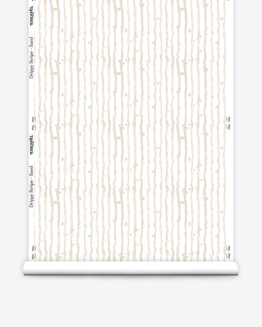 A roll of Drippy Stripe Wallpaper Sand with white and beige tones