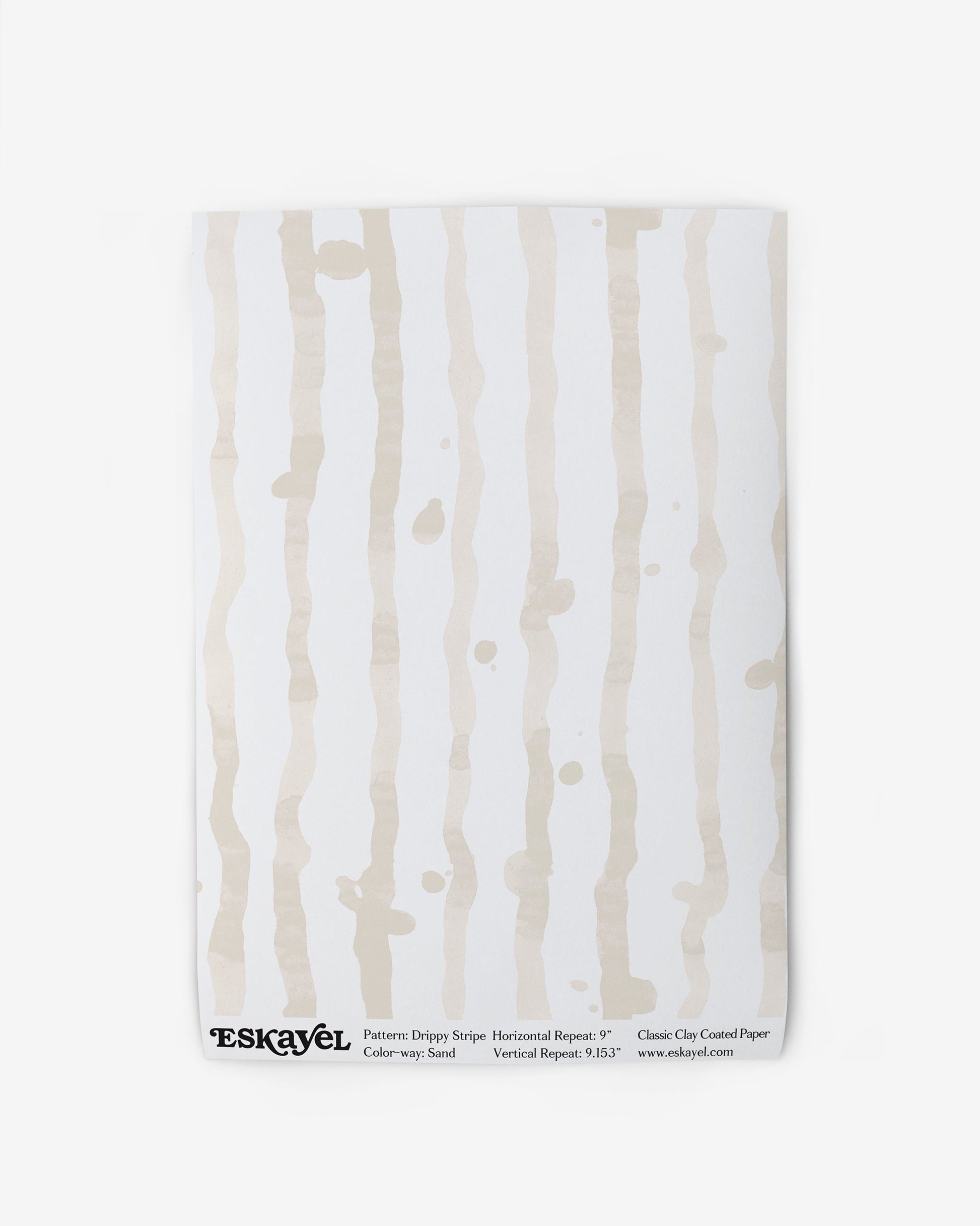 A product description for a Drippy Stripe Wallpaper Sample||Sand. You can also order a sample.