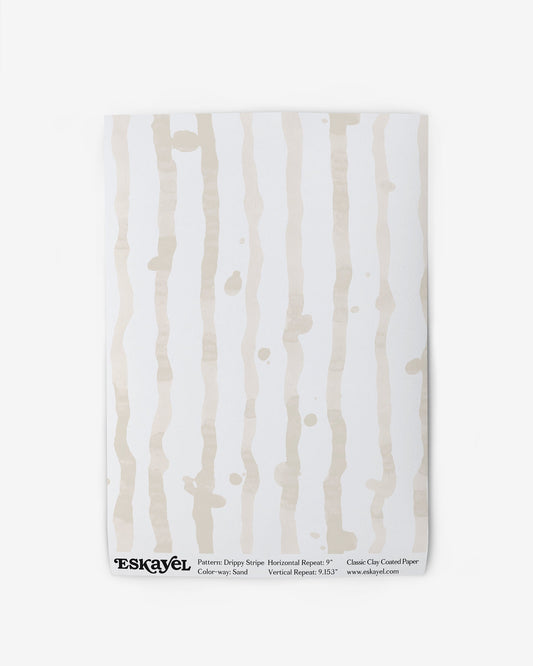 A product description for a Drippy Stripe Wallpaper Sample Sand You can also a sample