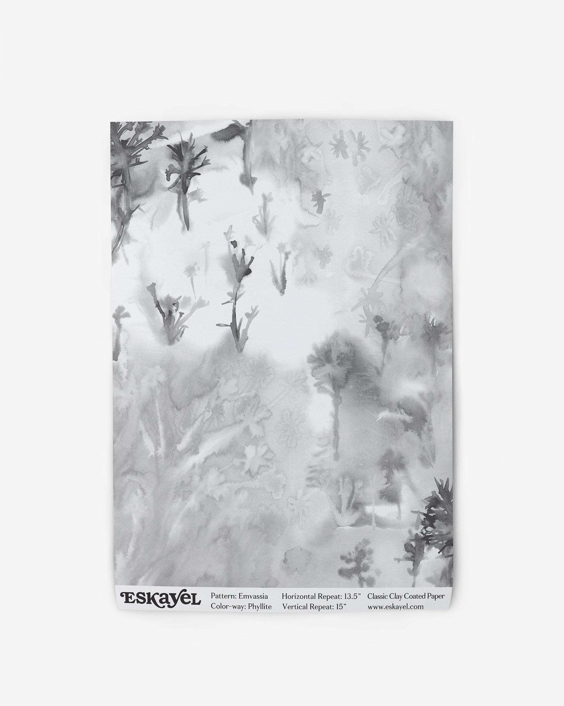 A black and white image of a Emvasia Wallpaper Phyllite in a forest fabric