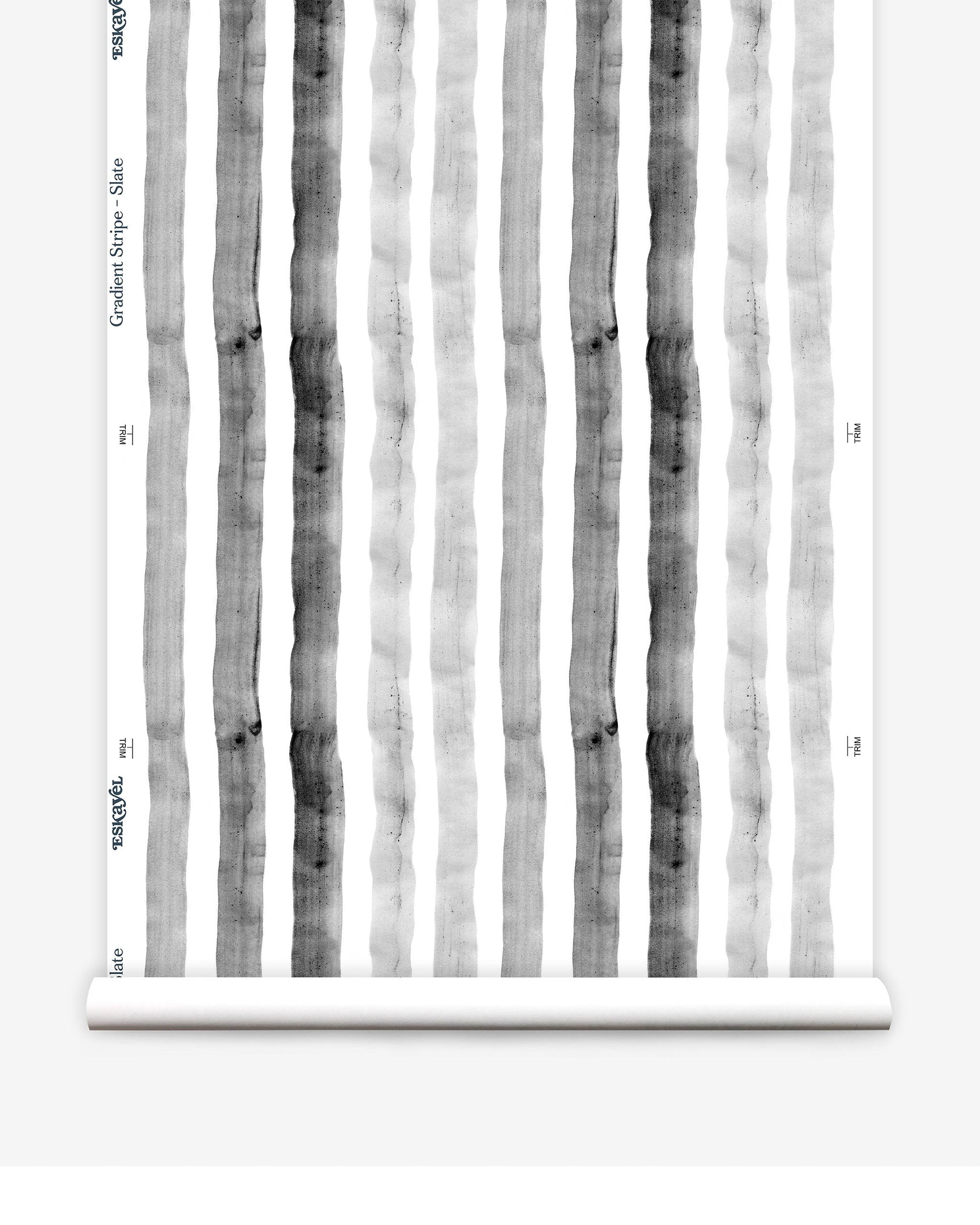 A roll of Gradient Stripe Wallpaper Slate with black and white gradient stripes