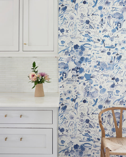 A blue and white floral Nuit Wallpaper in a kitchen