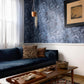 A luxury Aquarelle Wallpaper Ocean couch in a living room