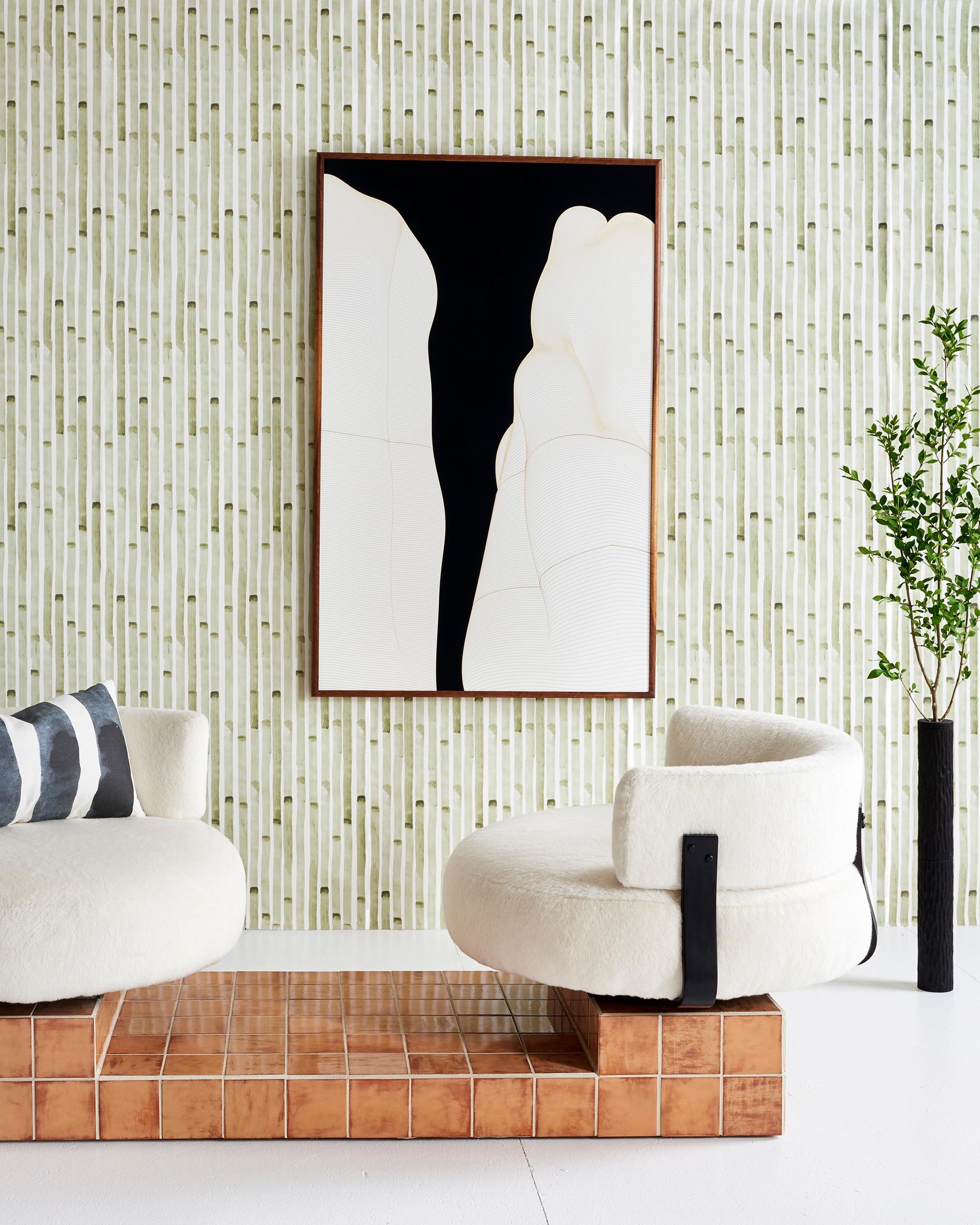 A living room with two white chairs and a Bamboo Stripe Wallpaper Brush on the wall