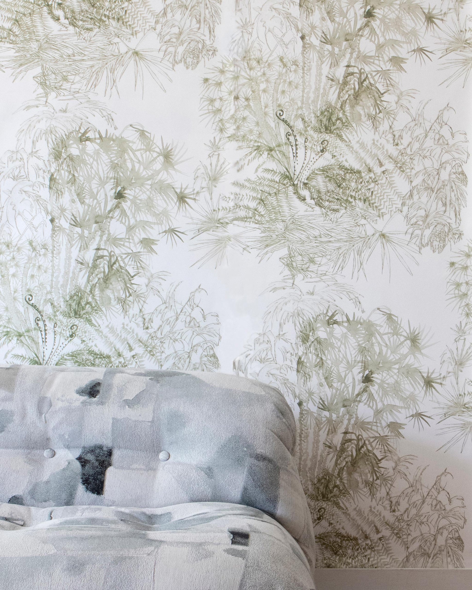 A bed in a room with Domenica Wallpaper Brush pattern