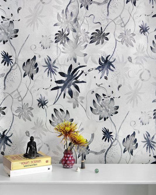 A chinoiserie-inspired Edera Wallpaper Ice with flowers on it
