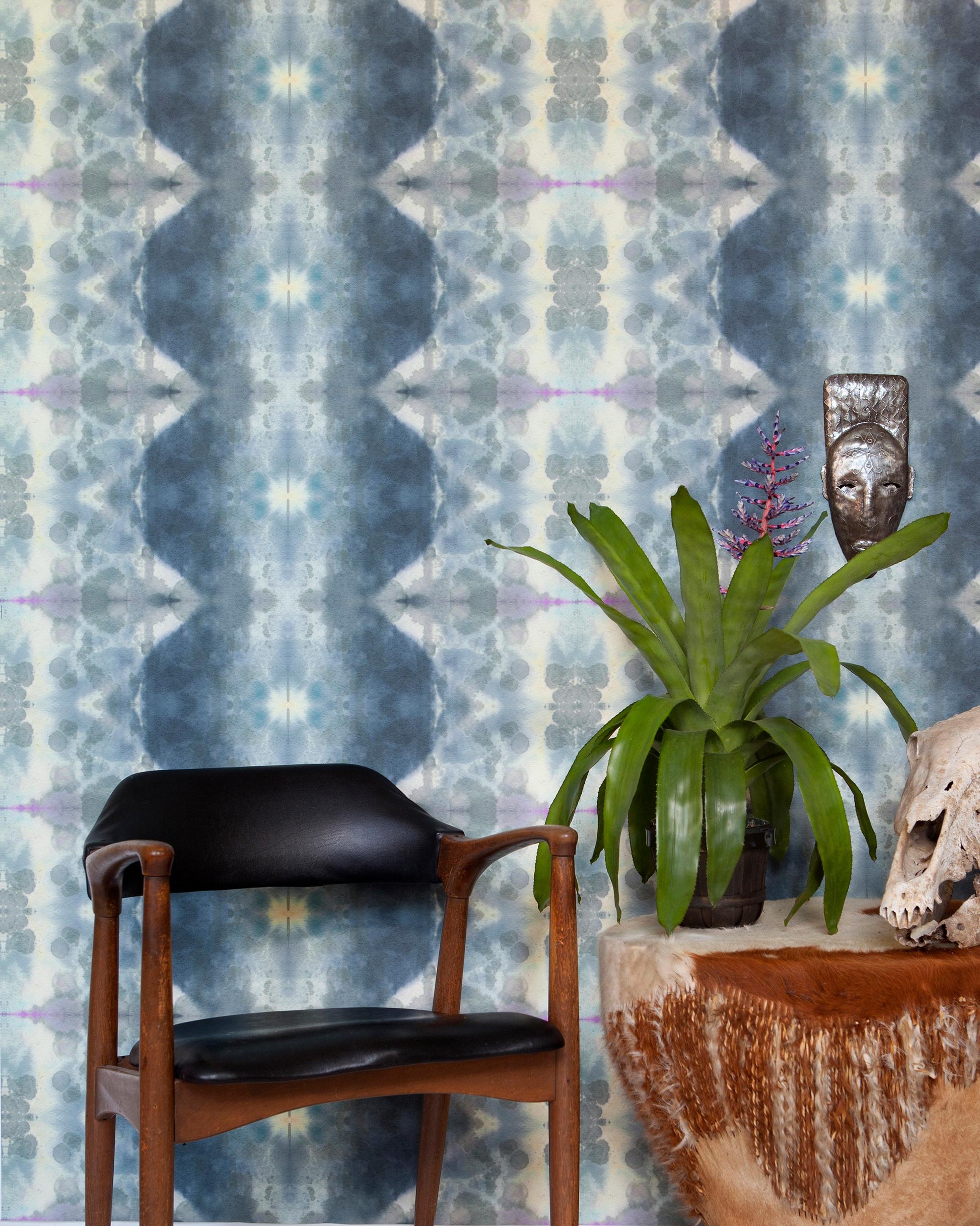 A blue and white Jangala Wallpaper Waterstone in front of a wooden chair