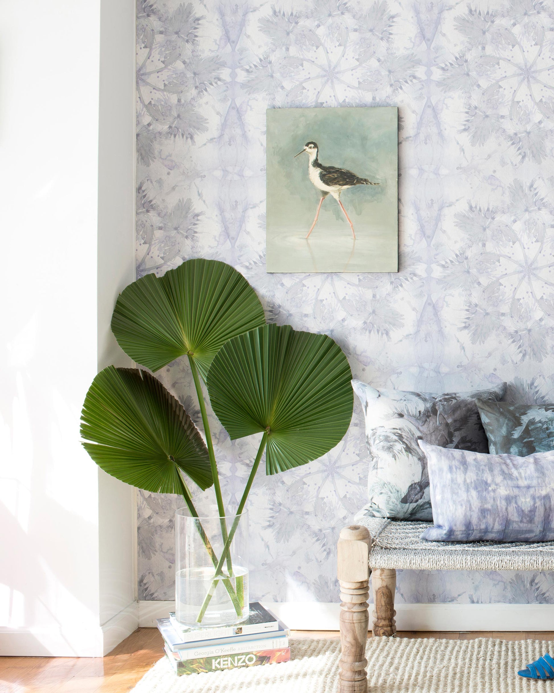 A living room with the Laurel Forest Wallpaper and a Dove, creating a tropical atmosphere