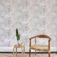 A room with a white chair and Palmeti Wallpaper Luminosa fabric pattern