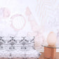 A white couch is sitting in front of a white wall with the Sea Galaxy Wallpaper Coral mural artwork