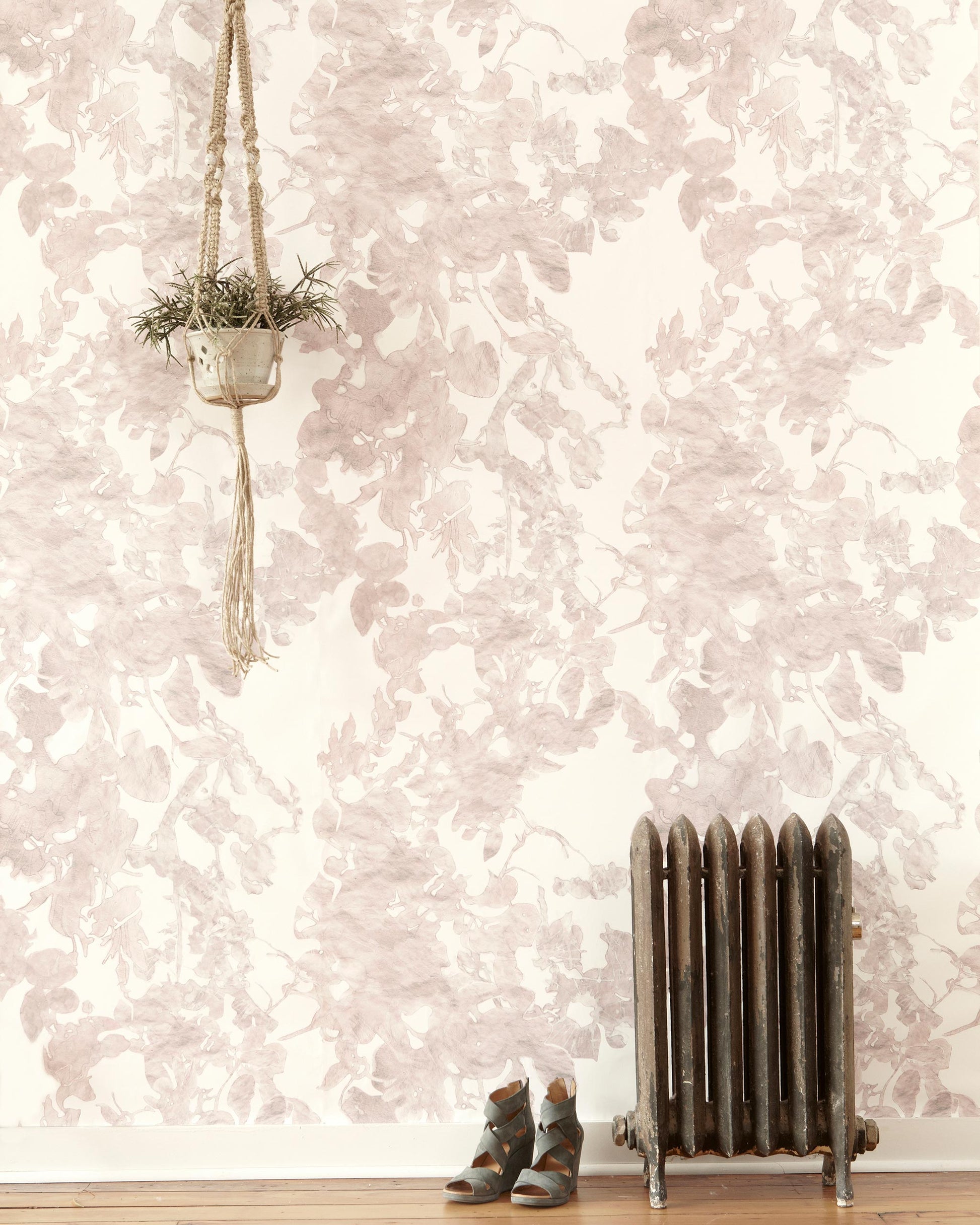A room with Up For Anything Wallpaper Glimmer on the walls and a radiator