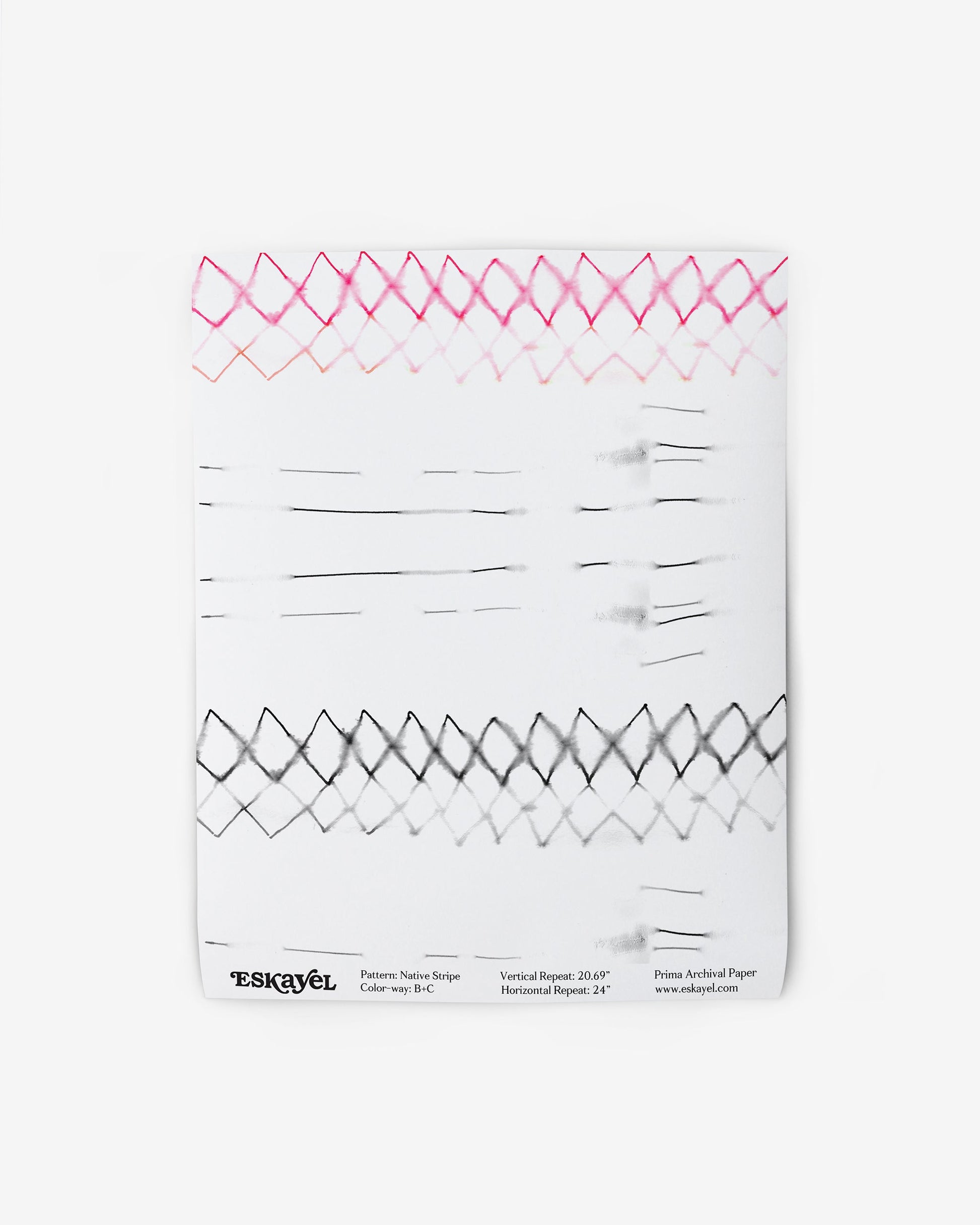 A white piece of paper with a graphic pattern of Native Stripe Wallpaper Black + Crimson on it