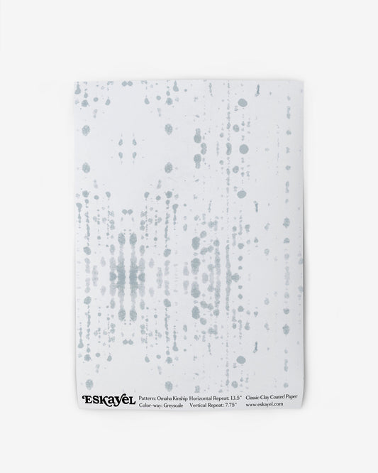 An Omaha Kinship Wallpaper Sample Grey with dots on it