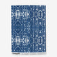 A blue and white towel with Omaha Kinship Wallpaper called Indigo Ikat.