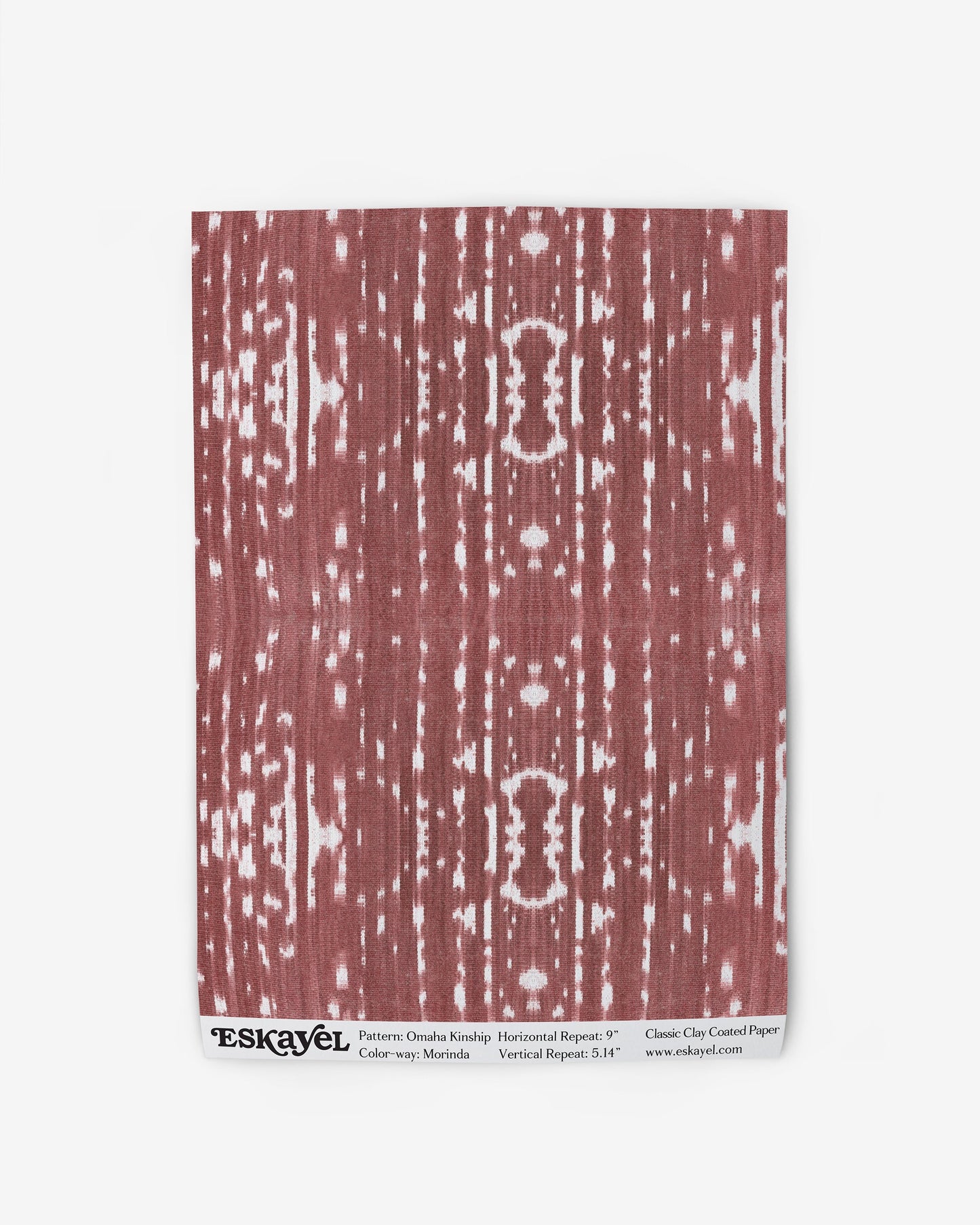 A red and white abstract pattern on Omaha Kinship Wallpaper Morinda Ikat