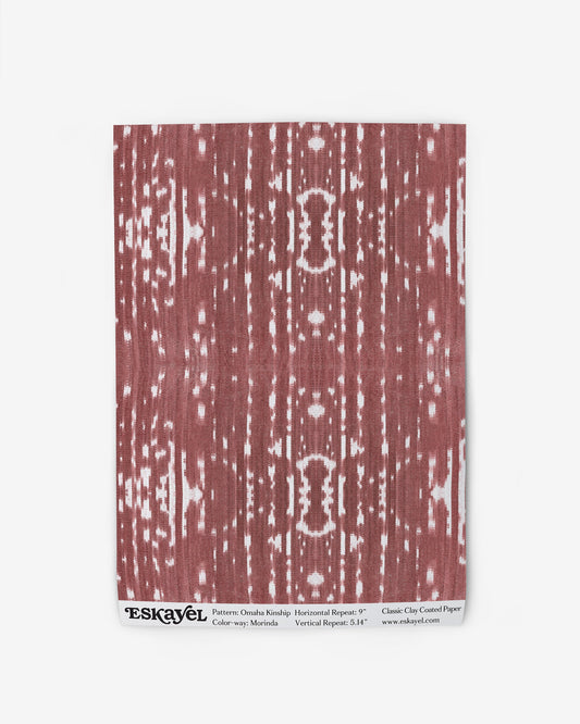 A red and white Omaha Kinship Wallpaper Sample on a sample