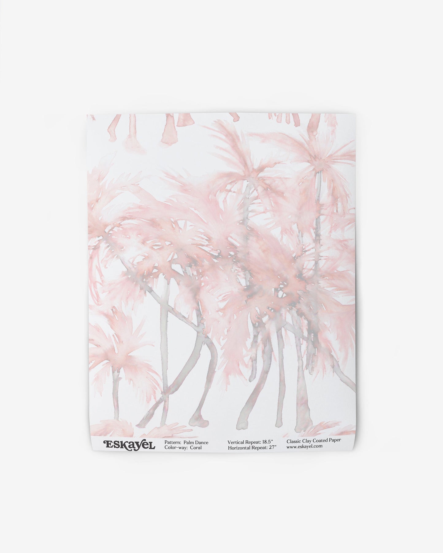 A pink and white luxury fabric with a watercolor pattern of Palm Dance Wallpaper Coral on it