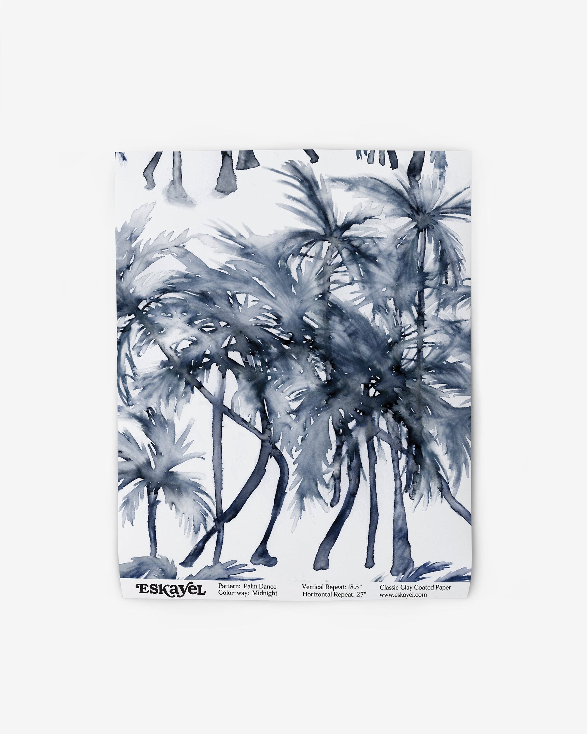 A blue and white painting of palm trees on wallpaper The palm trees create a watercolor pattern on the Palm Dance Wallpaper Midnight fabricon wallpaper