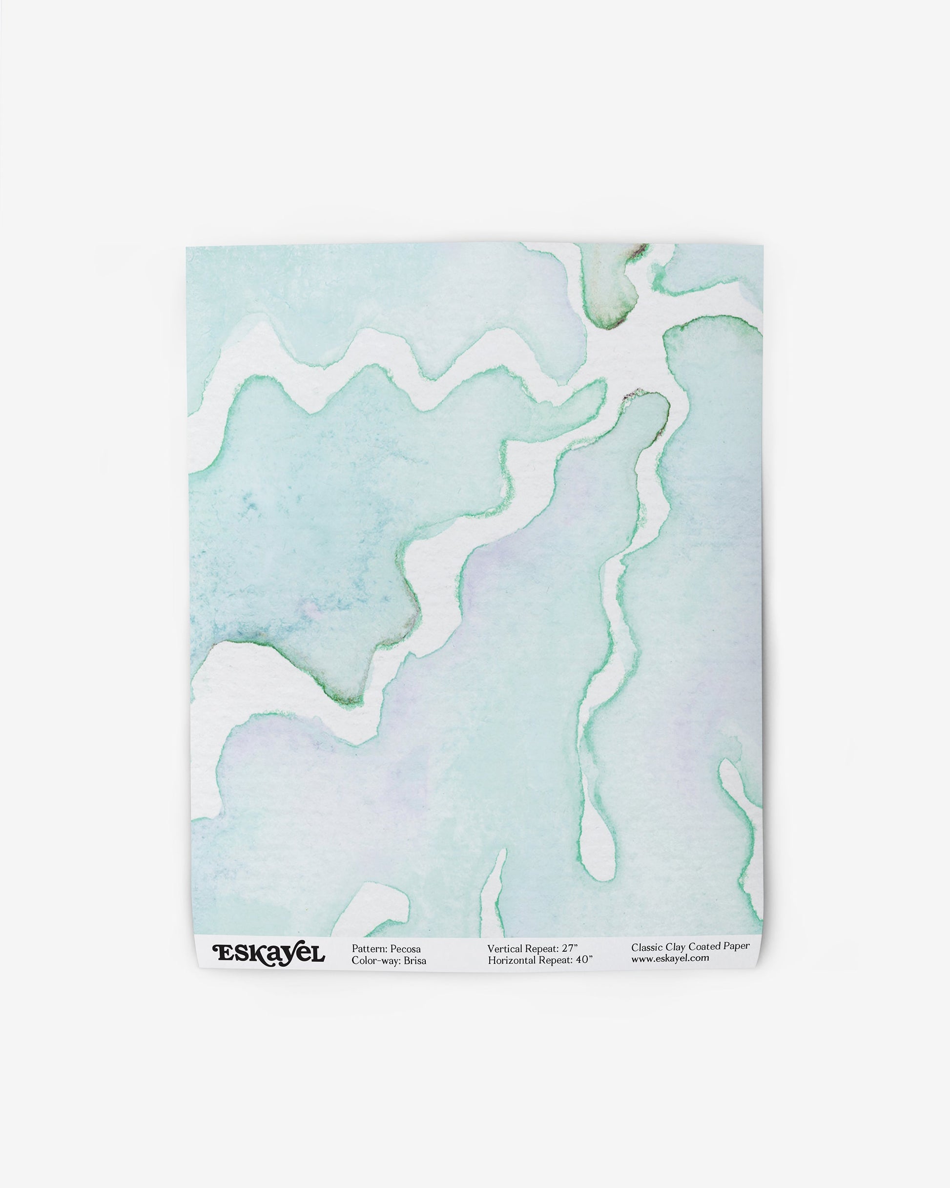 A notebook with a Pecosa Wallpaper Brisa watercolor design on its fabric cover
