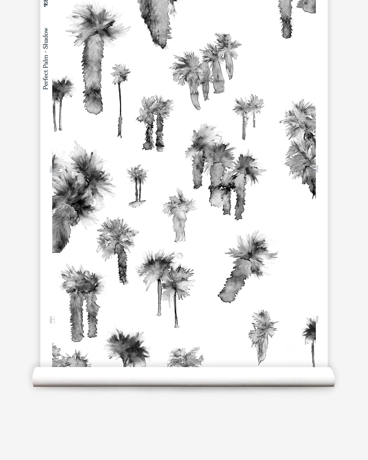 A black and white print of palm trees in a watercolor style on a roll of Perfect Palm Wallpaper Shadow luxury fabric