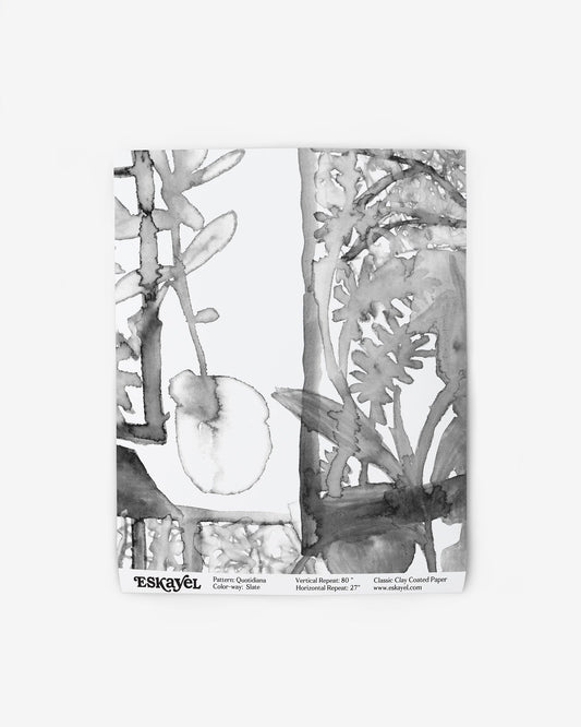 A Quotidiana Wallpaper Sample Slate consisting of a black and white drawing of plants on wallpaper, is availableon wallpaper