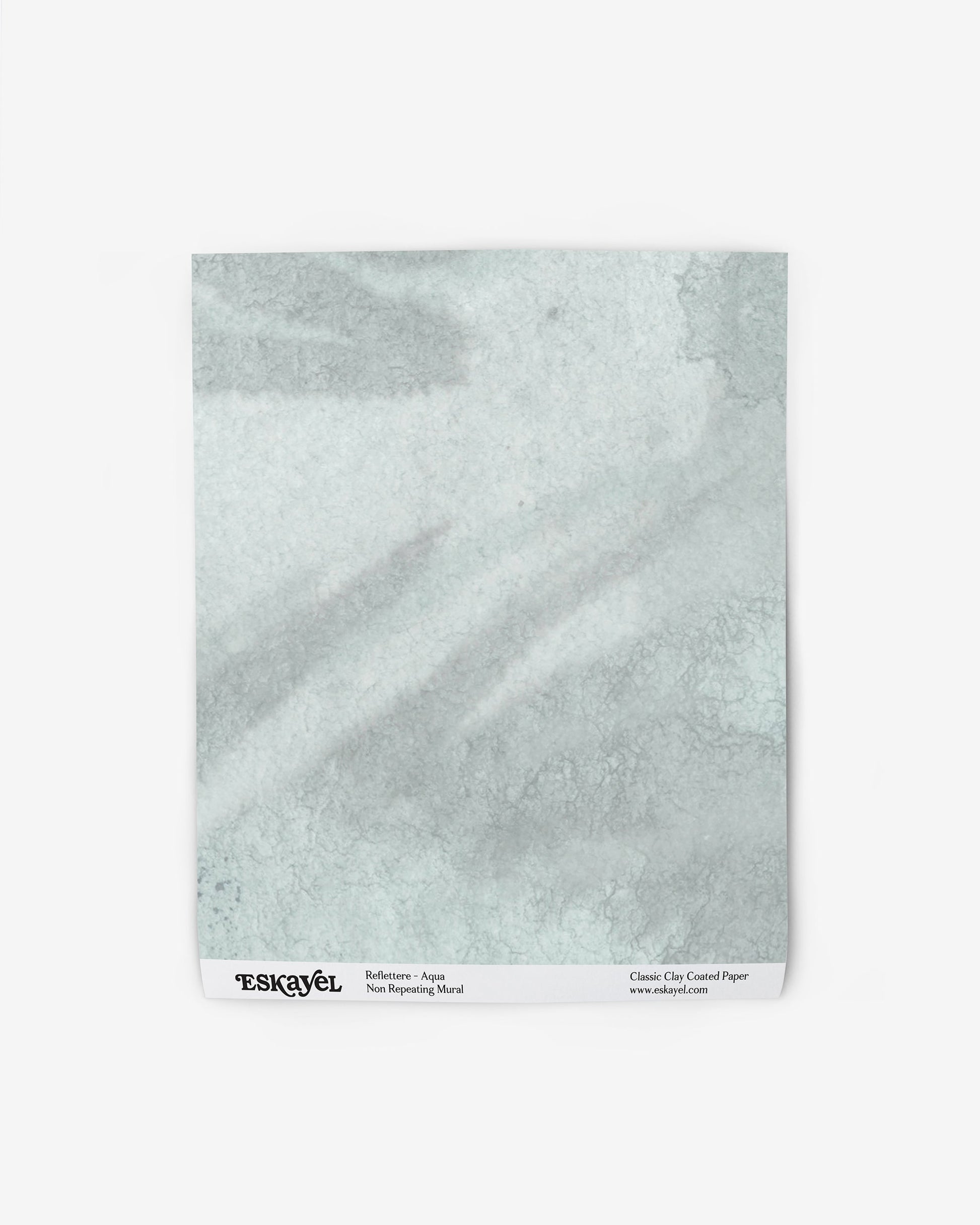 a sample of Reflettere Wallpaper Sample Aqua on wallpaper
