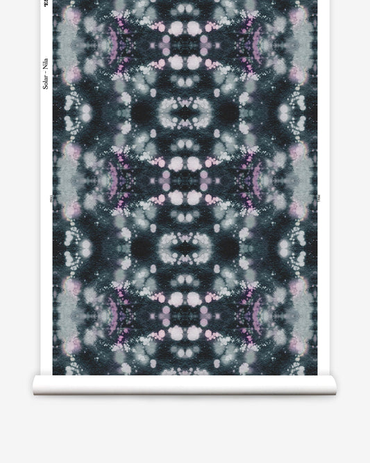 A black and purple tie dye pattern on a roll of Solar Wallpaper Nila paper