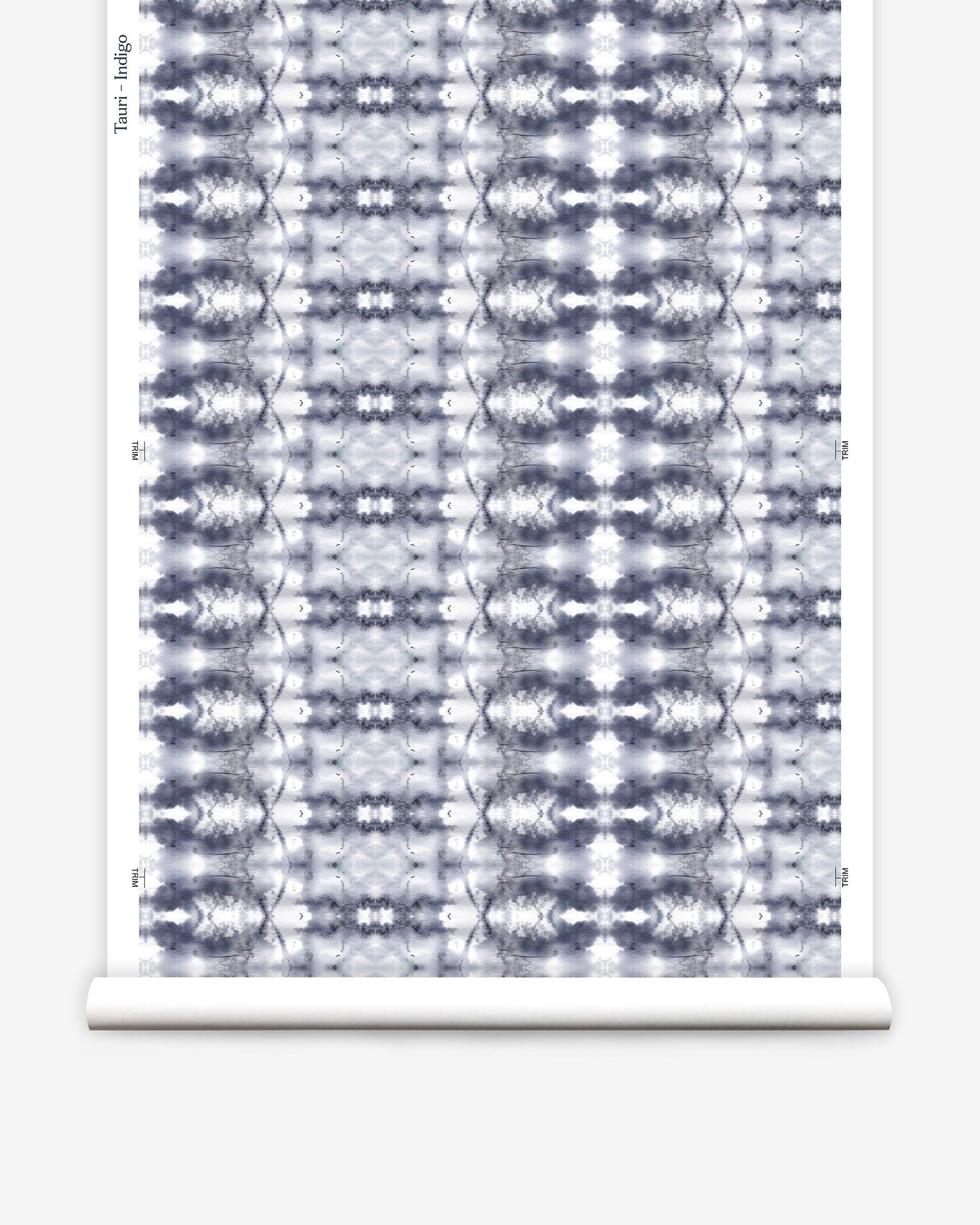 A blue and white pattern on a roll of Tauri Wallpaper Indigo