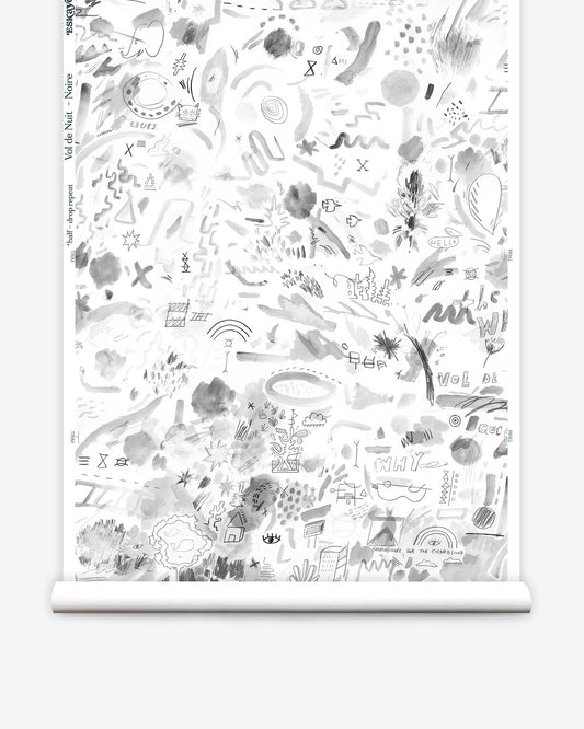 A roll of Vol de Nuit Wallpaper Noire with a black and white drawing by Eskayel