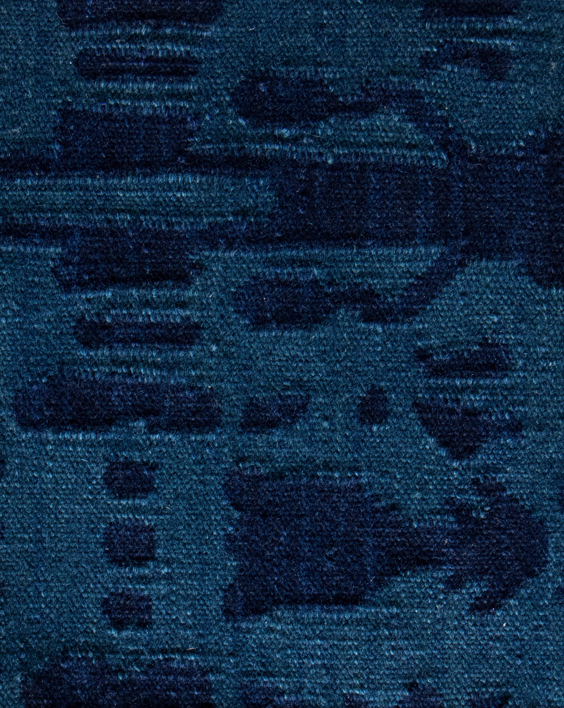 A close up of a blue fabric with Biami Flatweave Rug Deep Indigo pattern and colorway