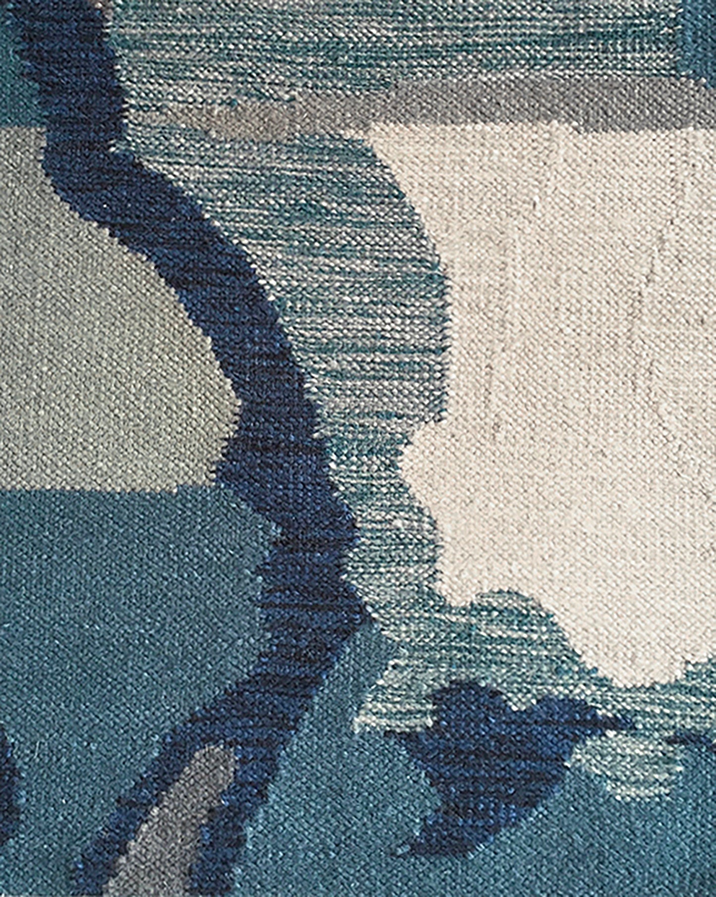 A close up of a Diego Flat Weave Rug Teal from the Presidio Collection