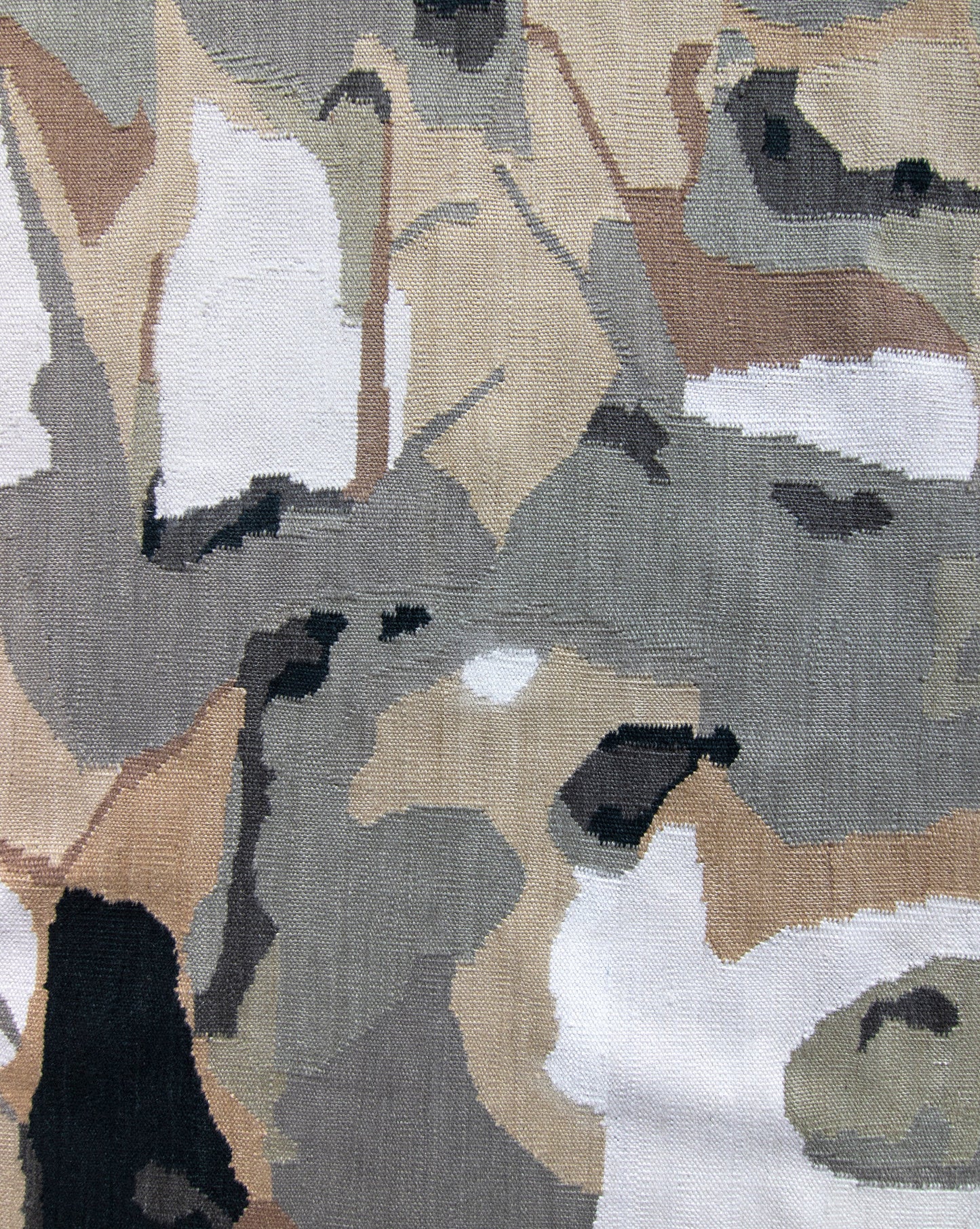 A close up of a Medina Flatweave Rug made from camouflage fabric