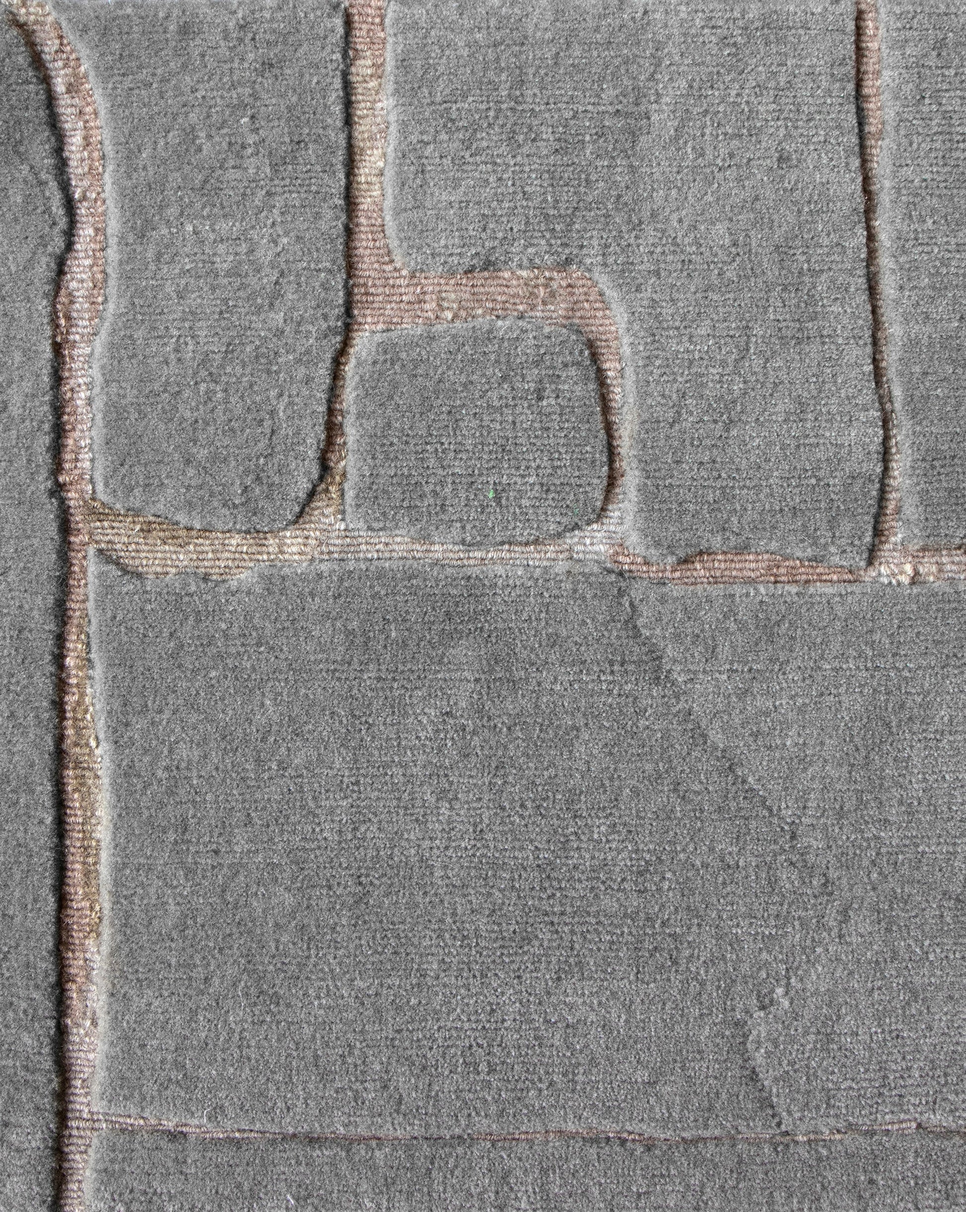 A close up of a Portico Hand Knotted Rug||Greyscale with a pattern on it.