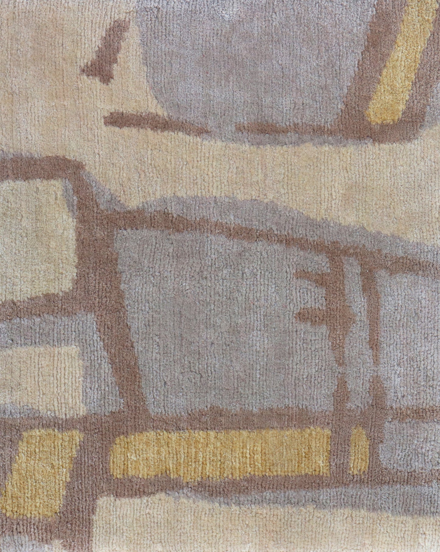 A yellow Quotidiana Hand Knotted Rug design with a beige and brown pattern.