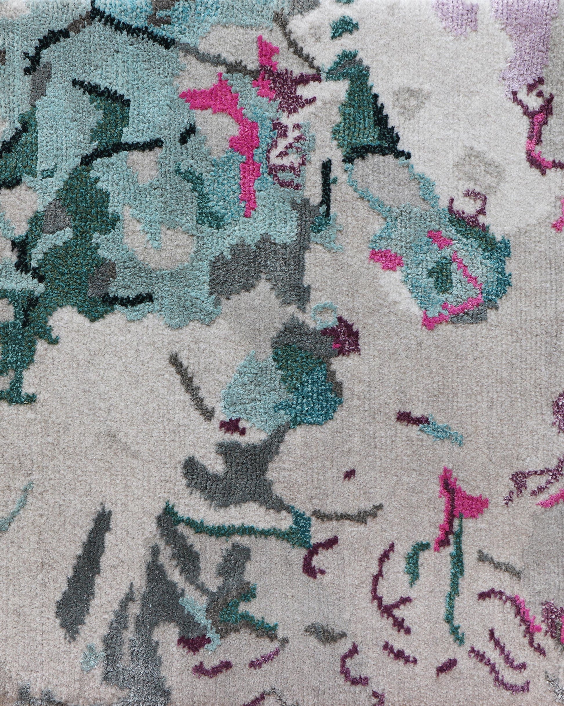 A close up image of a Bosky Toile Hand Knotted Rug with pink, blue, and green flowers in the Spectra colorway